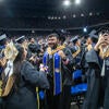 Graduates celebrating from seats